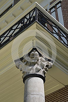 Pillar with acanthus ornament on a neoclassical building photo