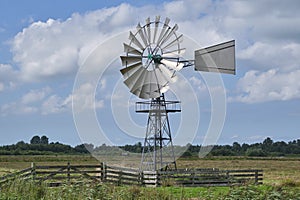 An american wind engine against a blue sky