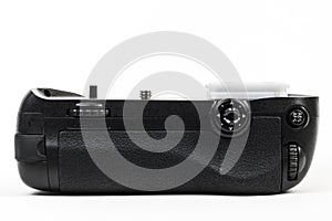 DSLR camera battery grip color black isolated in white. Back view.