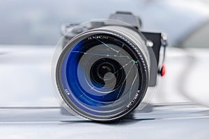 DSLR camera with broken lens filter. Cracked photo-filter