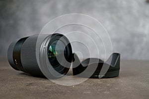 Dslr camera lense, close-up view on table with smooth background