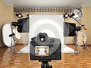 DSLR camera in photo studio with lighting equipment, softbox and photo