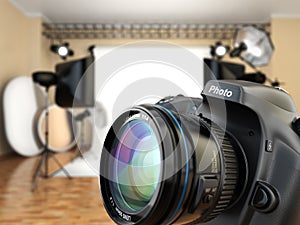 DSLR camera in photo studio with lighting equipment, softbox and photo