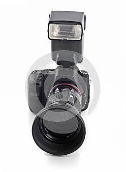 DSLR camera with telephoto lens and flash