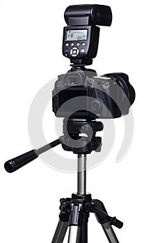 DSLR camera on tripod with external flash