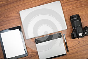 DSLR digital camera with tablet and notebook laptop