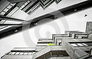 Dtails of balconies and their reflection on an old brutal concrete building