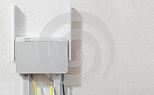 Dual-band home router attached to the wall, copy space