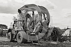 Dual function grapple skidder outdoors