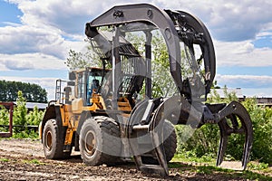 Dual function grapple skidder outdoors