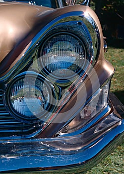 Dual headlamps in a diagonal pattern on a classic car