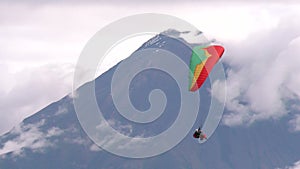 Dual Or Tandem Paragliding Against Volcano Crater