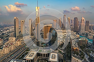 Dubai aerial view, cityscape with highways at sunset, modern urban architecture and traffic system, United Arab Emirates