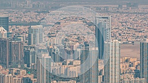 Dubai Aerial view showing al barsha heights and greens district area timelapse