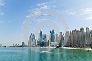 Dubai city - amazing city center skyline at suny day, United Arab Emirates