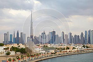 Dubai city skyline with Burj Khalifa skyscraper and residential buildings in a cloudy day