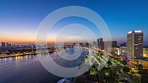 Dubai creek landscape day to night timelapse with boats and ship near waterfront