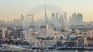 Dubai creek landscape timelapse with waterfront and modern buildings in the background during sunset