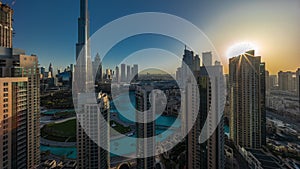 Dubai Downtown cityscape during sunrise with tallest skyscrapers around aerial