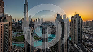 Dubai Downtown cityscape during sunrise with tallest skyscrapers around aerial timelapse