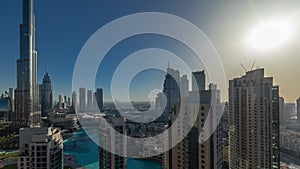 Dubai Downtown cityscape during sunrise with tallest skyscrapers around aerial timelapse