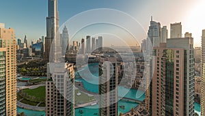 Dubai Downtown cityscape during sunrise with tallest skyscrapers around aerial timelapse