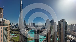 Dubai Downtown cityscape during sunrise with tallest skyscrapers around aerial timelapse