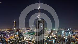 Dubai Downtown day to night timelapse modern towers panoramic view from the top in Dubai, United Arab Emirates.