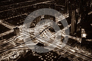 Dubai downtown night scene with city lights. Top view