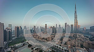 Dubai Downtown night to day timelapse with tallest skyscraper and other towers photo