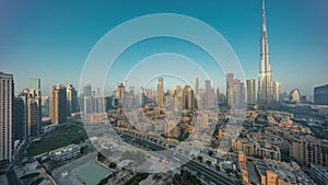 Dubai Downtown night to day timelapse with tallest skyscraper and other towers photo