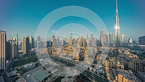 Dubai Downtown night to day timelapse with tallest skyscraper and other towers photo