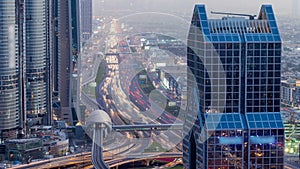 Dubai downtown skyline day to night and Sheikh Zayed road traffic, UAE