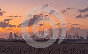 Dubai Downtown skyline with desert sand, United Arab Emirates or UAE. Financial district and business area in smart urban city.