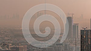 Dubai Downtown skyline row of skyscrapers with tallset tower aerial morning timelapse. UAE