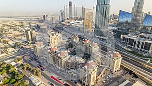 Dubai downtown skyline at sunset timelapse and road traffic near mall, UAE