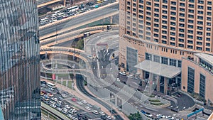 Dubai downtown street with busy traffic and skyscrapers around timelapse.