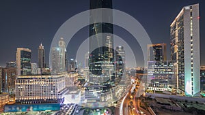 Dubai International Financial district aerial day to night timelapse. Panoramic view of business and financial office