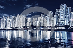 Dubai jumeirah beach with marina skyscrapers in UAE at night