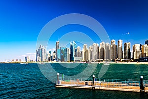 Dubai jumeirah beach with marina skyscrapers in UAE. Popular public JBR beach.