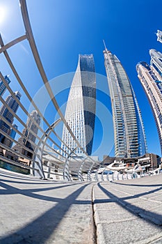 Dubai Marina with boats against skyscrapers in Dubai, United Arab Emirates