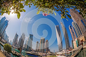 Dubai Marina with boats against skyscrapers in Dubai, United Arab Emirates