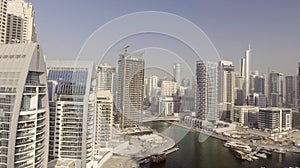 Dubai Marina buildings along artificial canal, aerial view - UAE