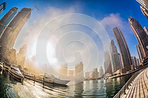 Dubai Marina is covered by early morning fog in Dubai, United Arab Emirates