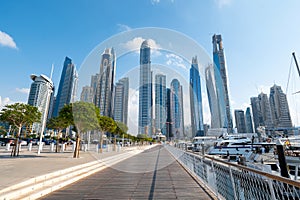 Dubai marina harbor on a sunny day in the UAE