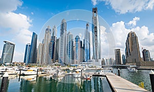 Dubai marina harbor on a sunny day in the UAE