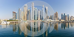 Dubai Marina and Harbour skyline architecture wealth luxury travel in United Arab Emirates panorama