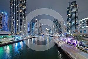 Dubai Marina and lake or river, Downtown skyline, United Arab Emirates or UAE. Financial district and business area in smart urban