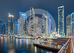 Dubai Marina and lake or river, Downtown skyline, United Arab Emirates or UAE. Financial district and business area in smart urban
