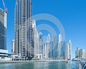 Dubai Marina and lake or river, Downtown skyline, United Arab Emirates or UAE. Financial district and business area in smart urban